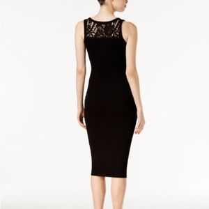 Michael Kors dress with a curve-hugging silhouette and a flirty lace back.NWT
